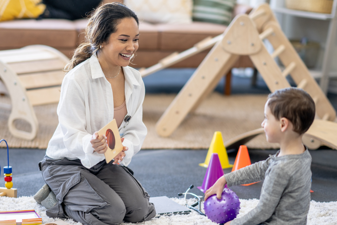 "Child engaged in Gestalt play therapy, using toys and creative activities to express emotions and develop coping skills.